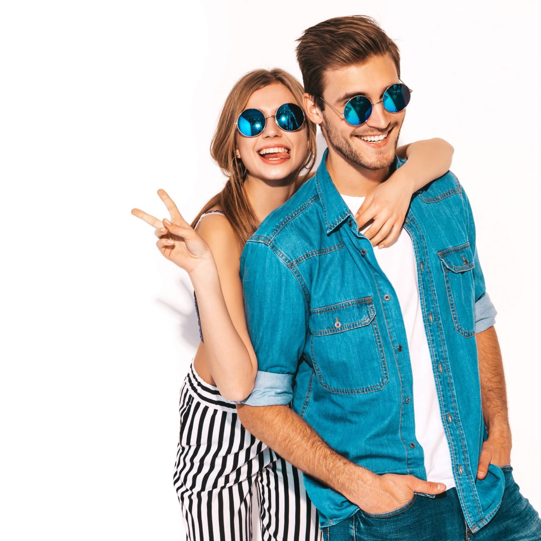 portrait-of-smiling-beautiful-girl-and-her-handsome-boyfriend-laughing-happy-cheerful-couple-in-sunglasses-and-showing-peace-sign (1)
